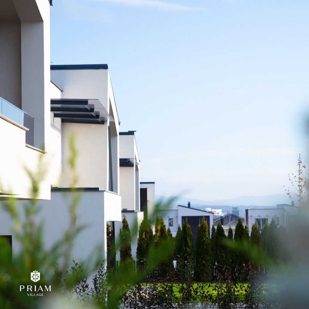 Modern villas framed by garden greenery